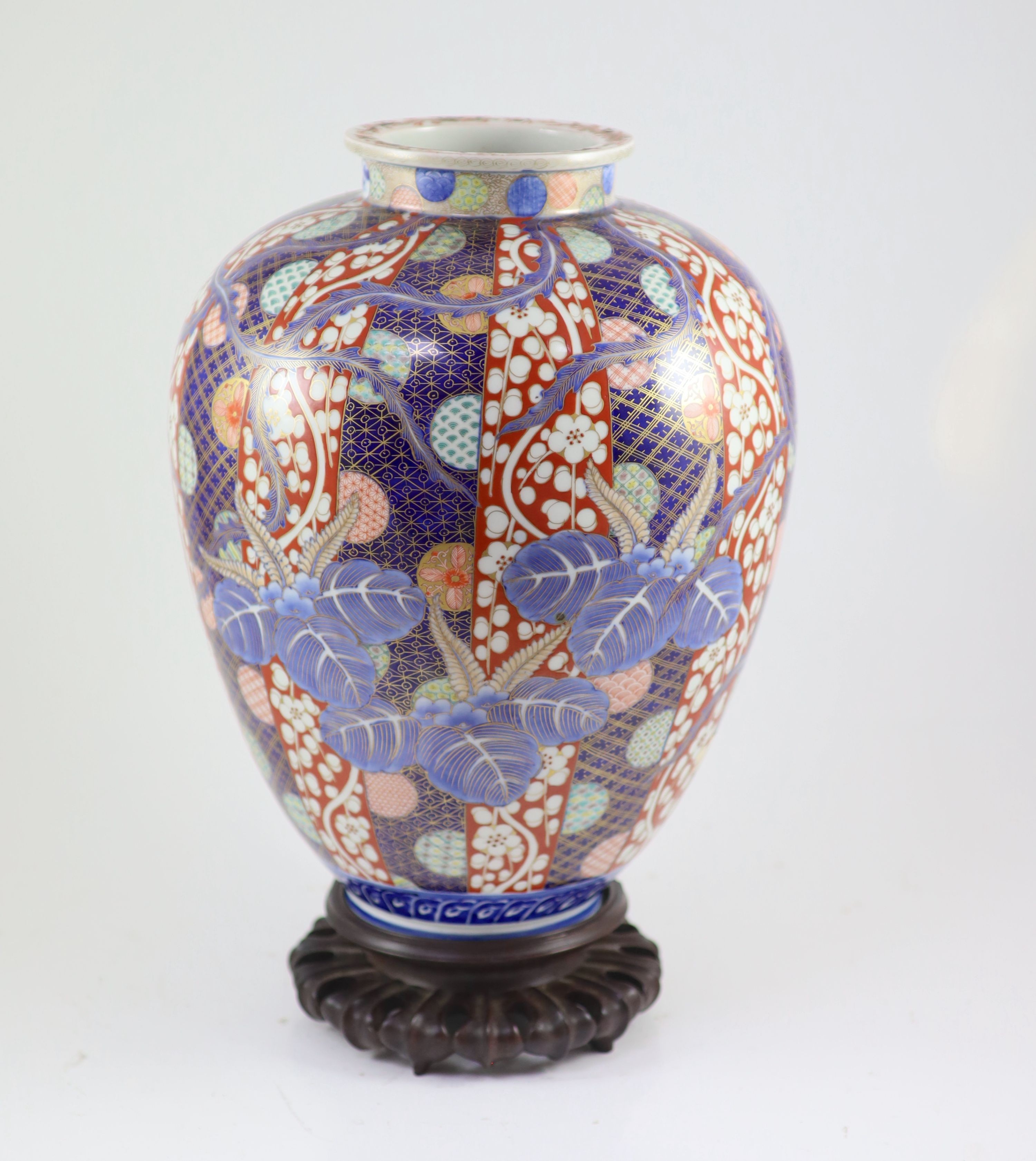 A large Japanese Imari ovoid vase, Meiji period, by Fukagawa, 37.5 cm high, wood stand